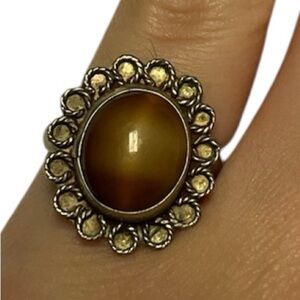 Sterling silver ring. Size 4. Unique brown stone. Beauty! Cool design